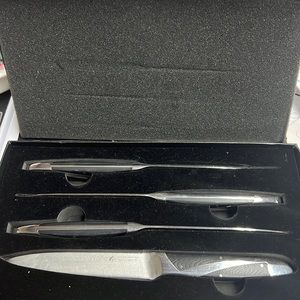 Preowned Wolfe 4 Pc Steak Knife Set. One is bent at the tip. See photos.
